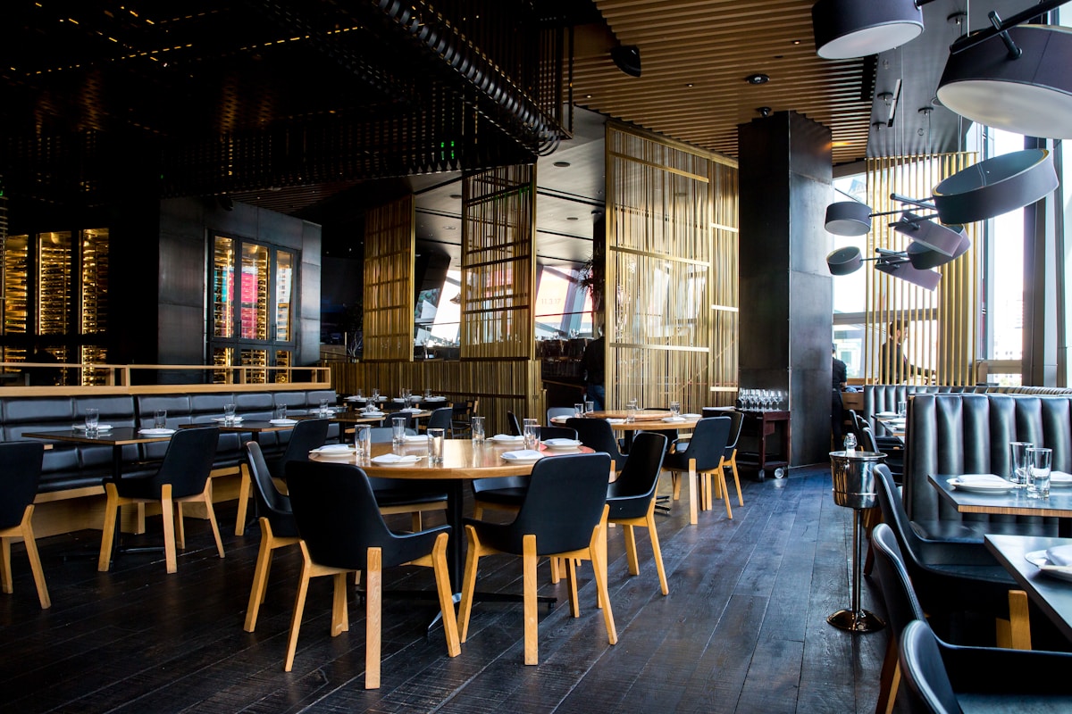 Warm modern restaurant dining room at Bowery Kuwait